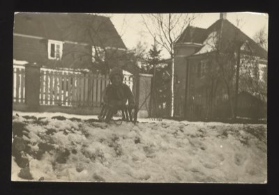The front likely shows a child (Norbert) cycling. Photographed in Basel, Switzerland, 1925. Same Norbert as in group 003 photo 0009.